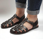 Sandalias planas marrón oscuras para las mujeres reales de cuero hecho a mano en Italia