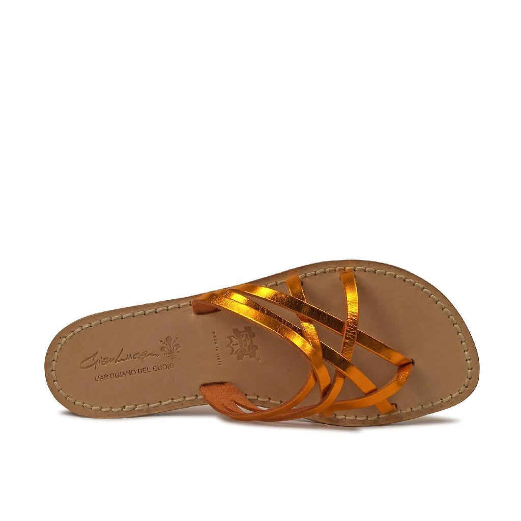 Ladies thong slippers in orange laminated leather