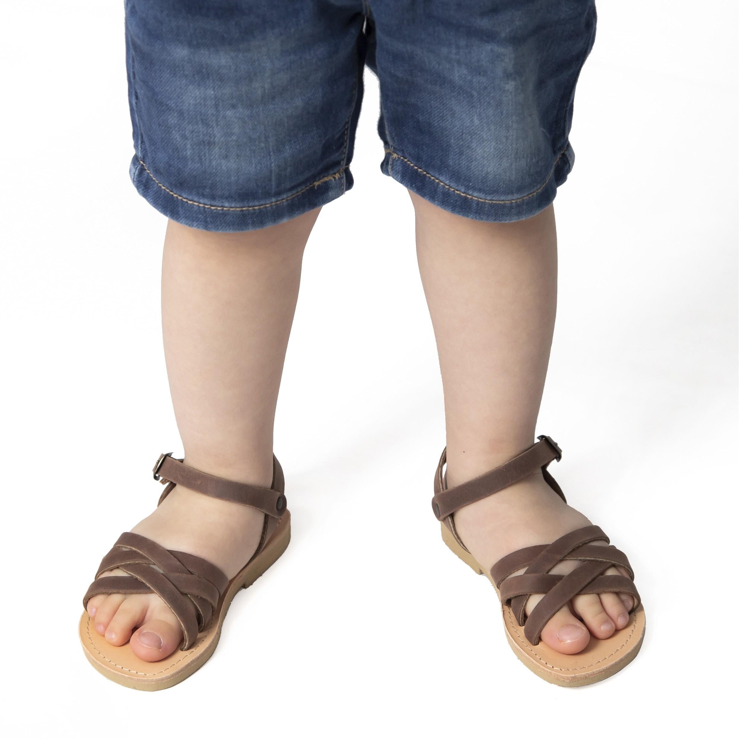 Sandali intrecciati gladiatore da bambino in pelle nubuck marrone chiusura con fibbia