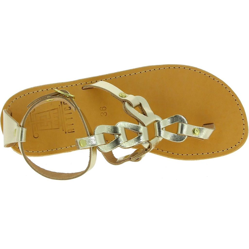 Sandali infradito da donna con lacci incrociati fatti a mano in pelle di vitello laminata oro