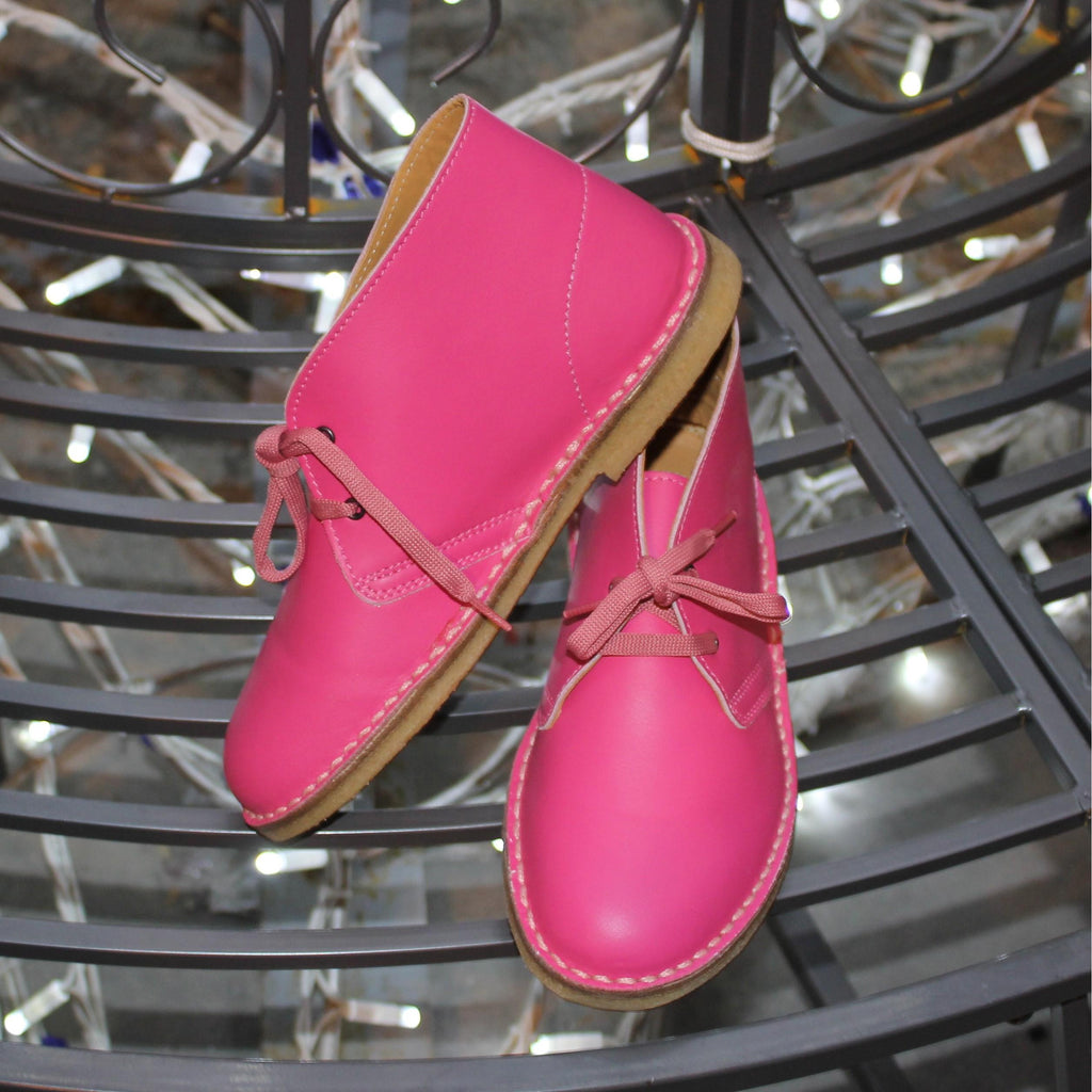 Polacchine da bambino in pelle fucsia fatte a mano in Italia